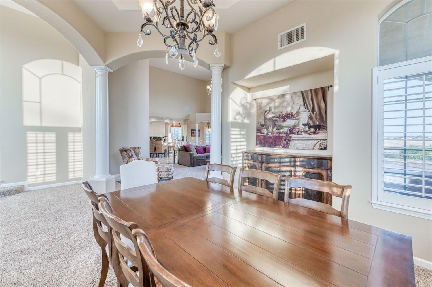 14374 Killarney Drive Madera, CA 93636 - Photo 29 of 56 a view of a dining room with furniture window and wooden floor