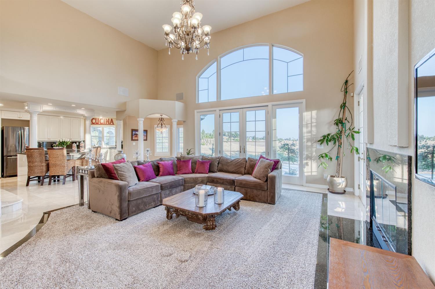 14374 Killarney Drive Madera, CA 93636 - Photo 30 of 56 a living room with furniture and a chandelier