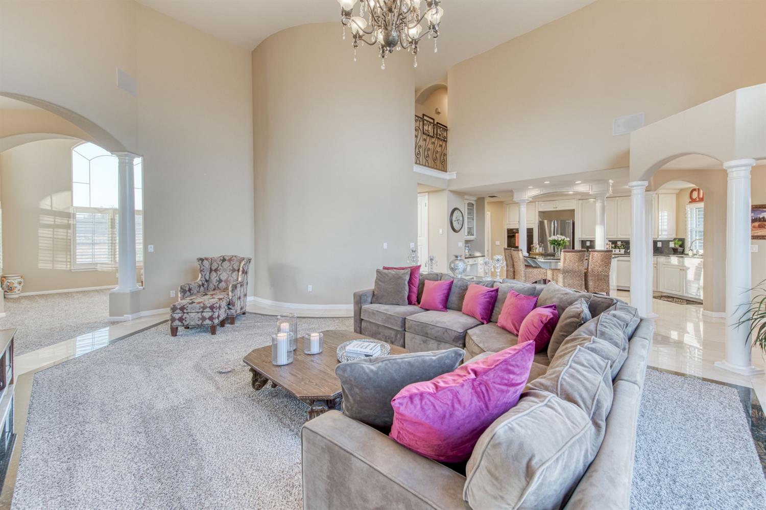 14374 Killarney Drive Madera, CA 93636 - Photo 31 of 56 a living room with furniture and a chandelier