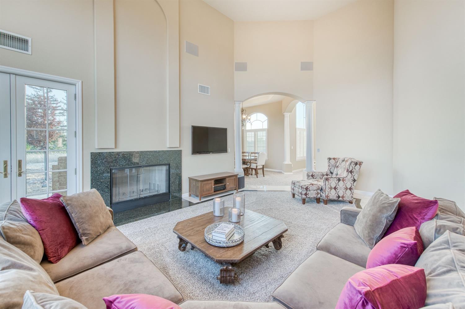 14374 Killarney Drive Madera, CA 93636 - Photo 32 of 56 a living room with furniture and a fireplace