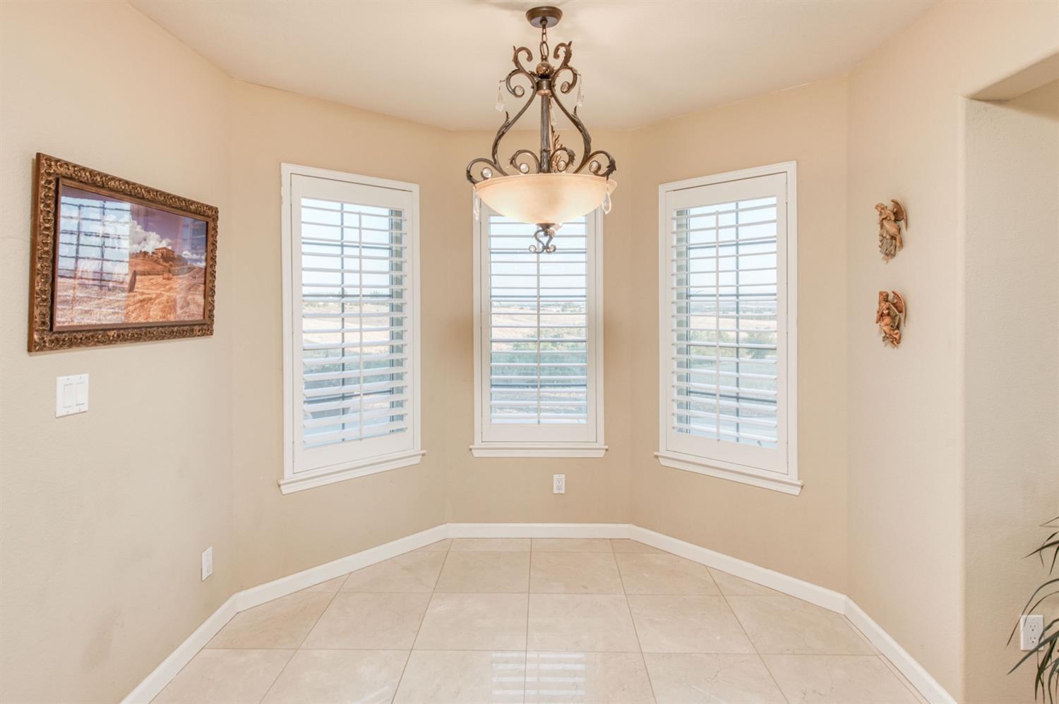 14374 Killarney Drive Madera, CA 93636 - Photo 37 of 56 a view of an empty room with a window