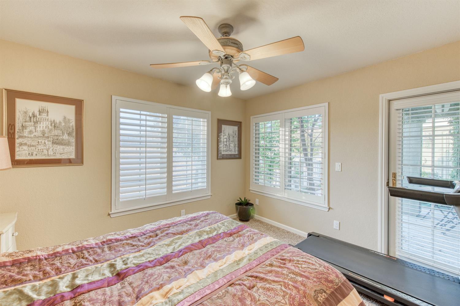 14374 Killarney Drive Madera, CA 93636 - Photo 38 of 56 a bedroom with a large bed and a window