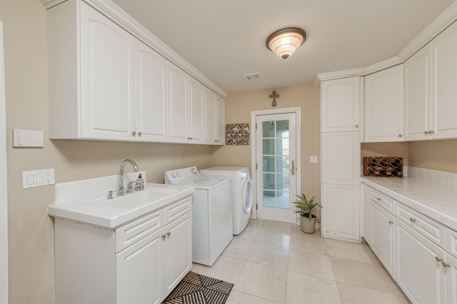 14374 Killarney Drive Madera, CA 93636 - Photo 41 of 56 a kitchen with cabinets appliances and a sink