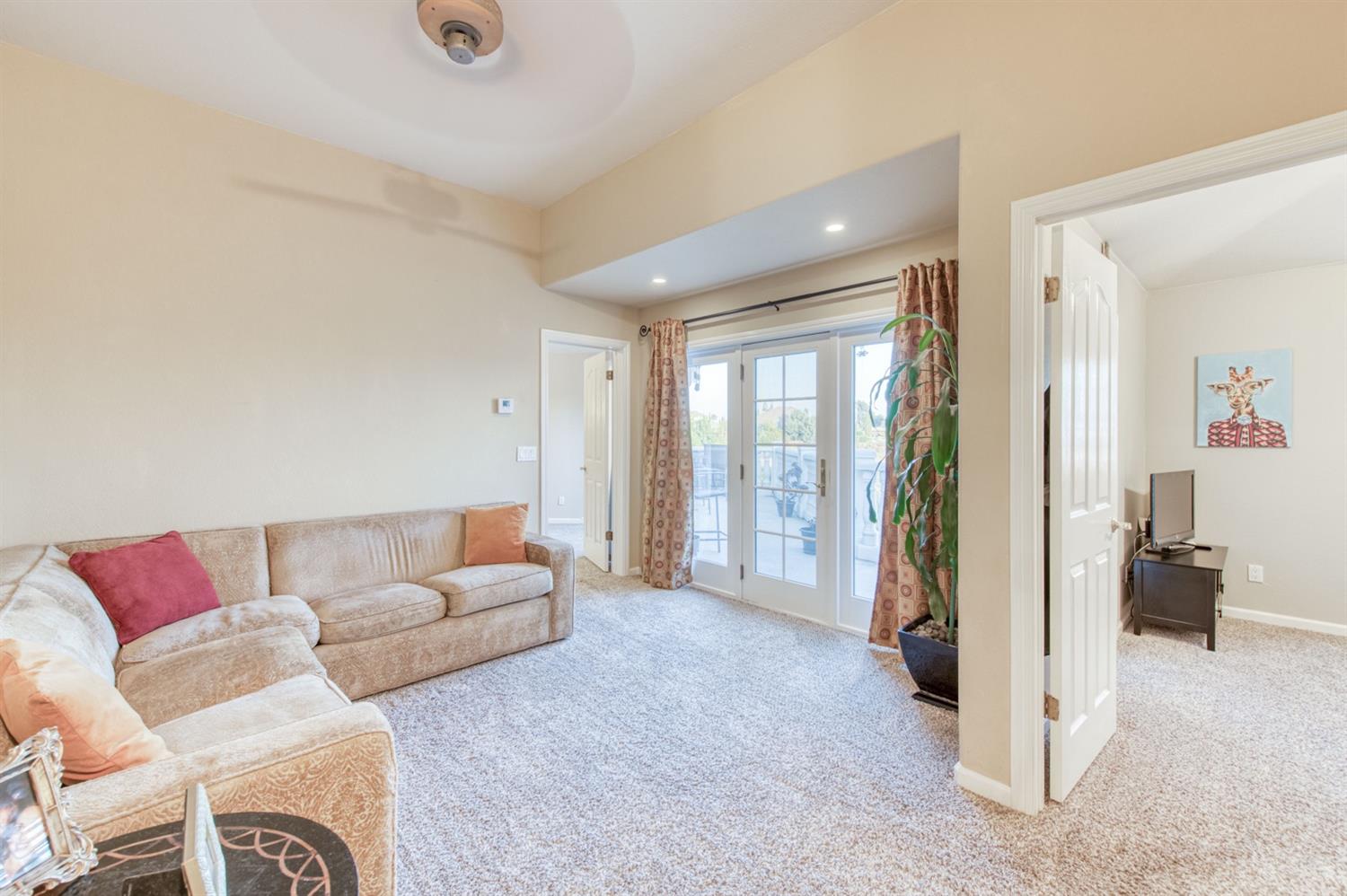 14374 Killarney Drive Madera, CA 93636 - Photo 42 of 56 a living room with furniture and a flat screen tv