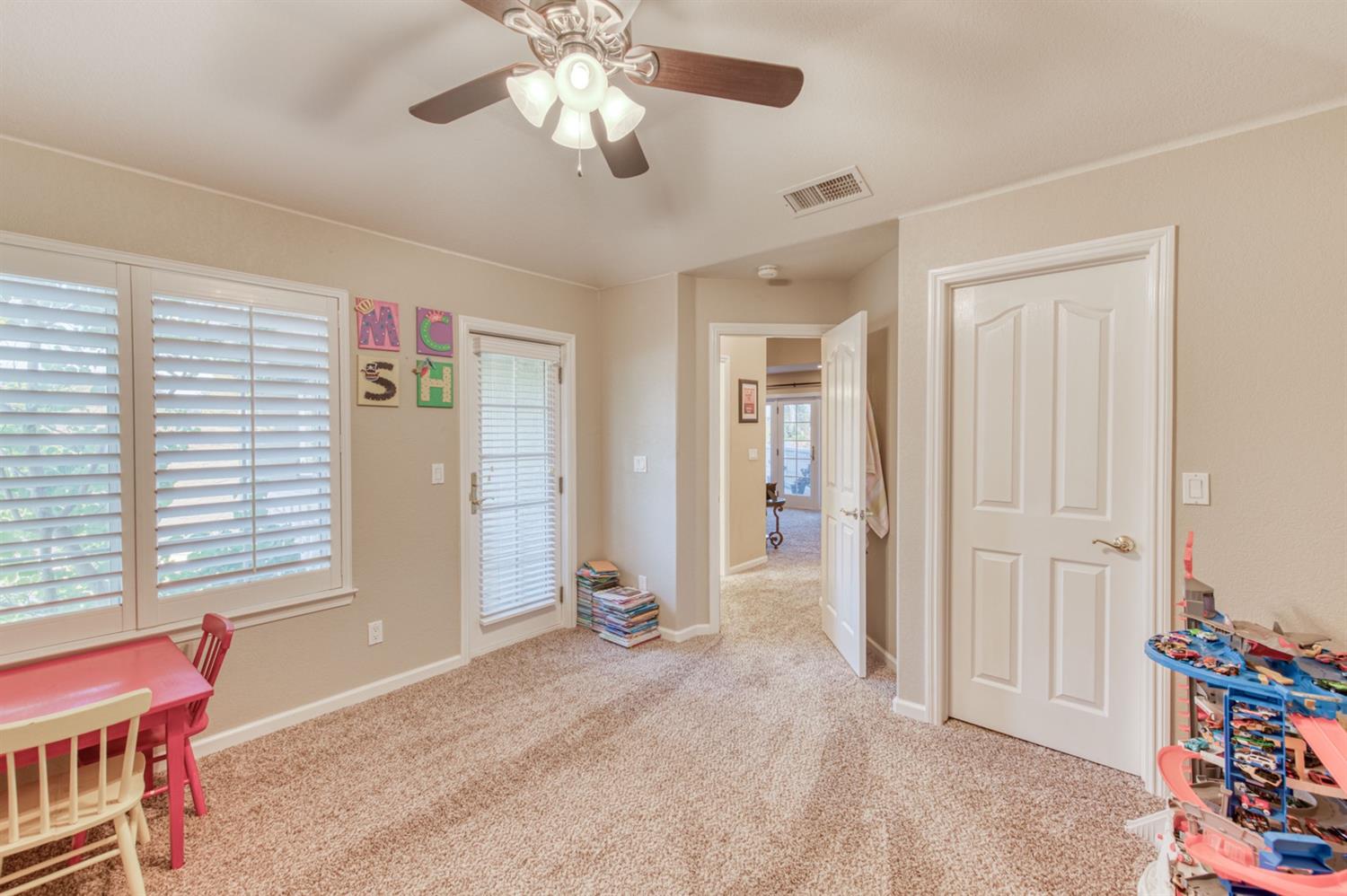 14374 Killarney Drive Madera, CA 93636 - Photo 47 of 56 an empty room with fan and windows