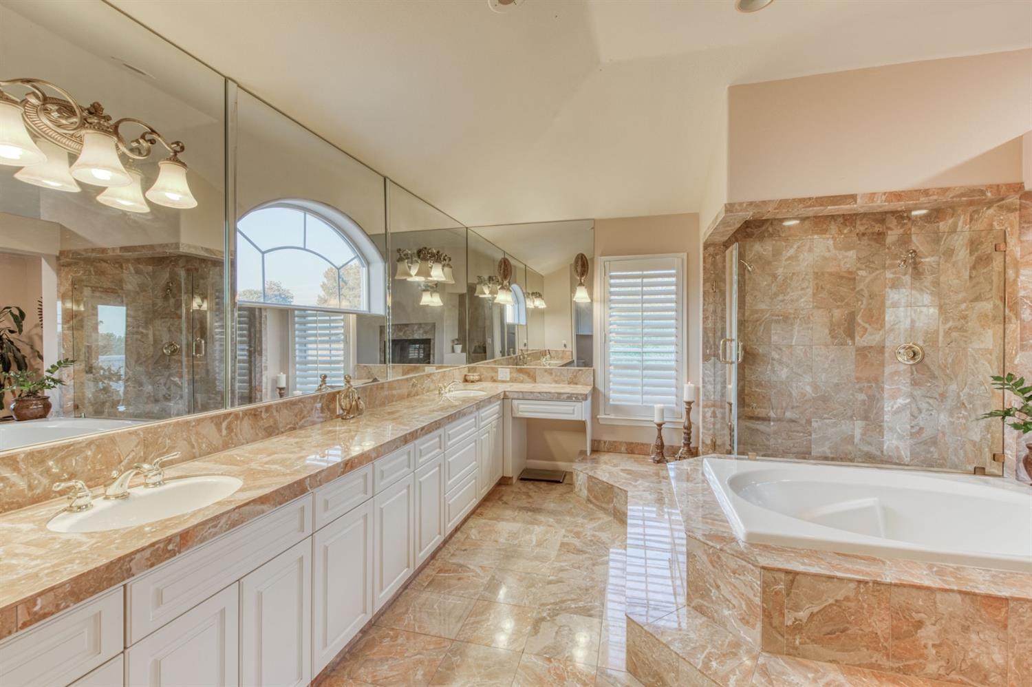 14374 Killarney Drive Madera, CA 93636 - Photo 51 of 56 a large bathroom with a large tub and sink