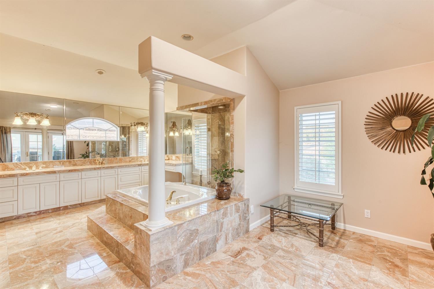 14374 Killarney Drive Madera, CA 93636 - Photo 52 of 56 a spacious bathroom with a tub and shower