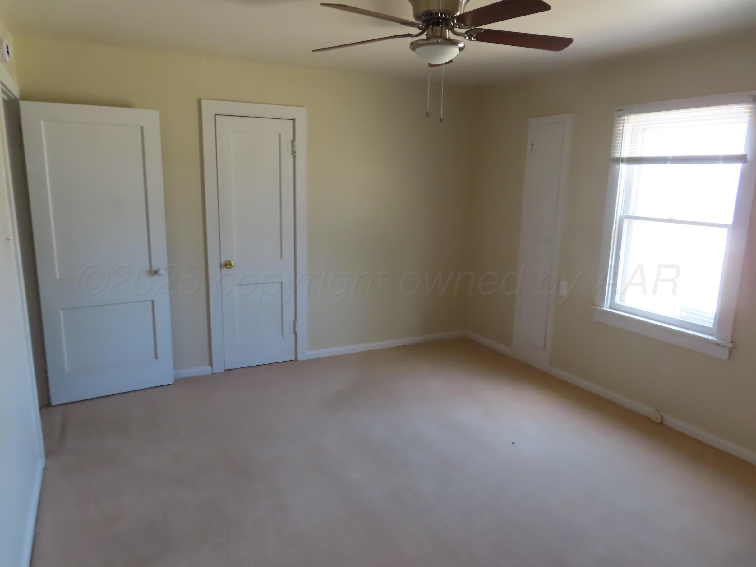 3813 South Washington Street Amarillo, TX 79110 - Photo 12 of 12 an empty room with a window