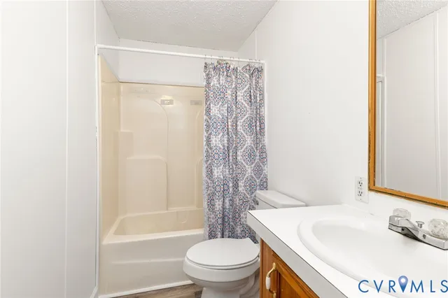 a bathroom with a sink a toilet and a bathtub