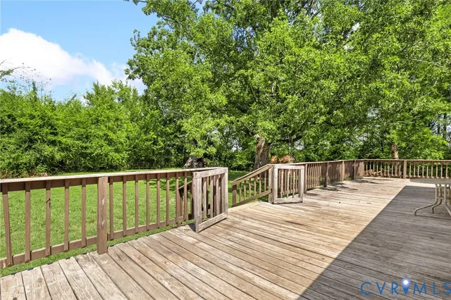 a view of deck with wooden floor and fence
