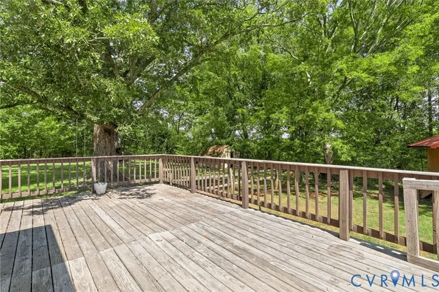 a balcony with view of trees in the background