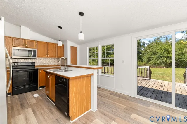 a kitchen with a stove oven and sink