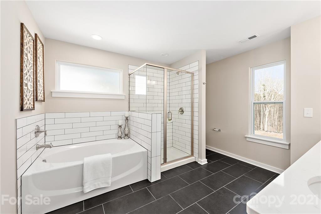115 Cranford Drive Pineville, NC 28134 - Photo 4 of 7 a bathroom with a bathtub and a shower