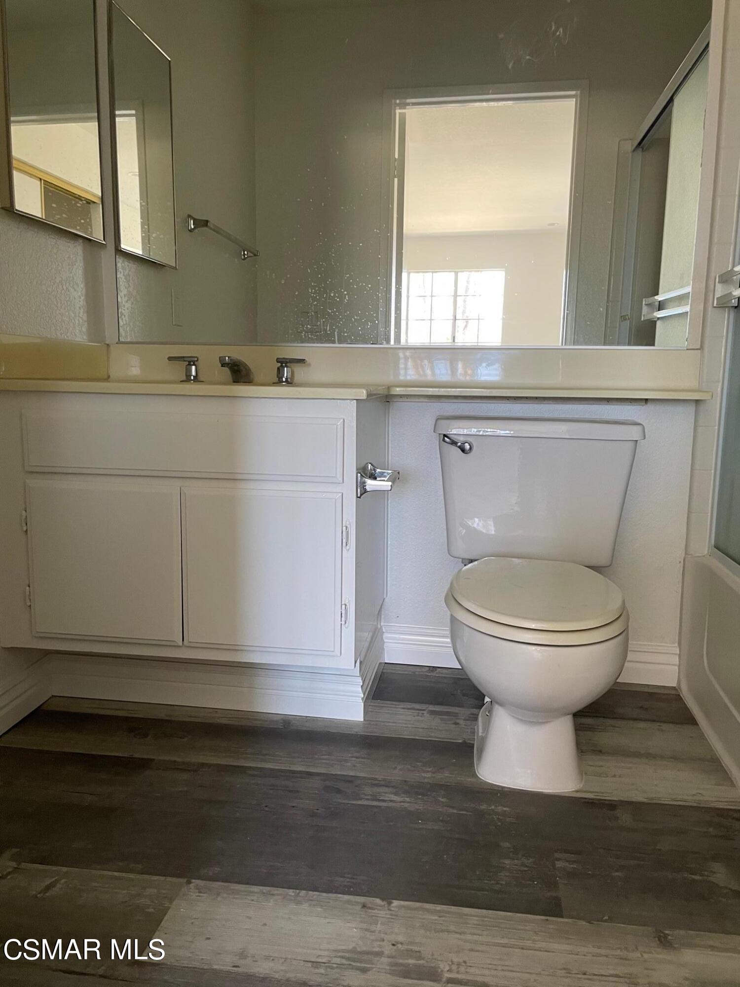 1007 Waltham Road, Unit D Simi Valley, CA 93065 - Photo 14 of 17 a bathroom with a toilet and a sink