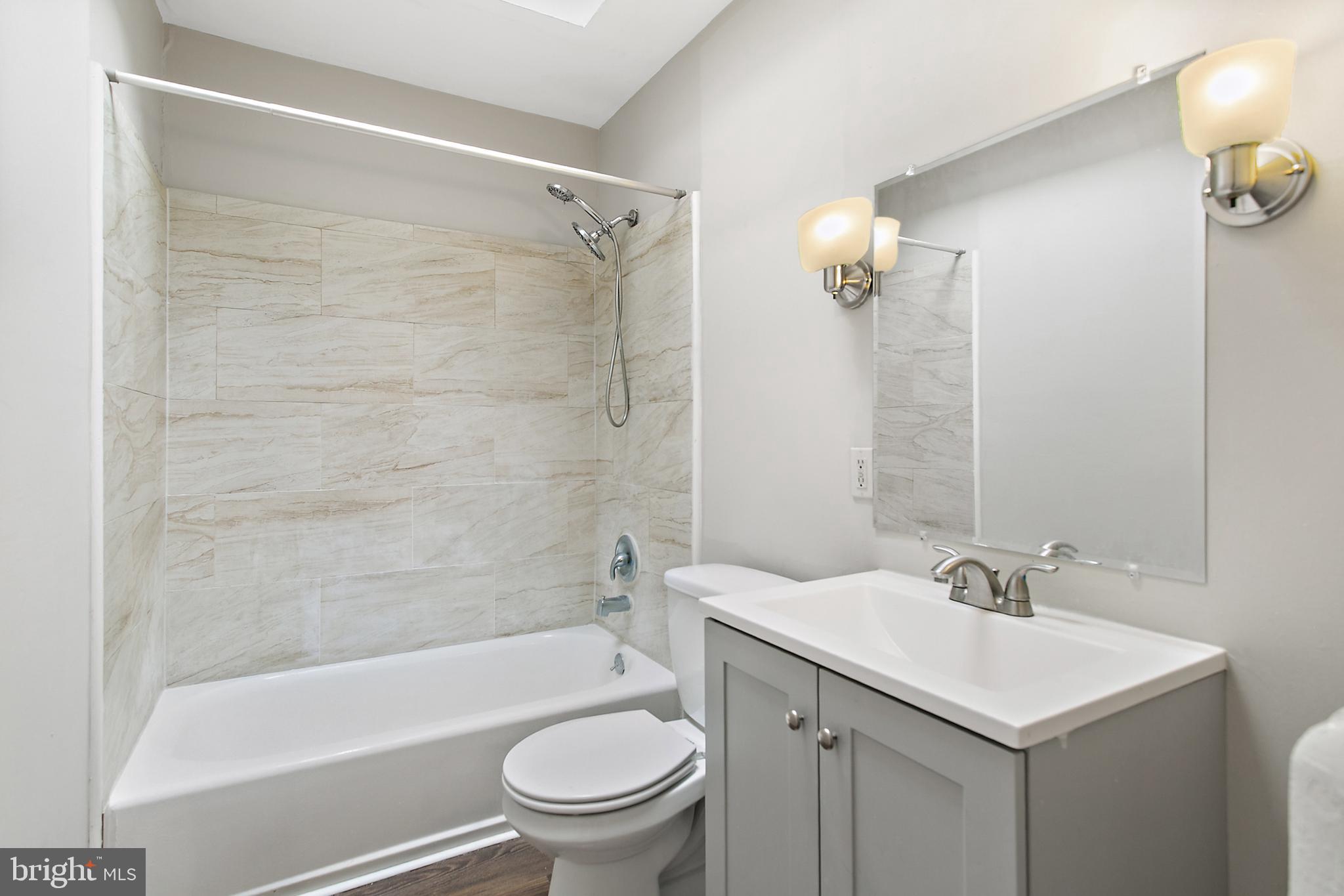 7158 Radbourne Road Upper Darby, PA 19082 - Photo 11 of 15 a bathroom with a sink toilet and shower