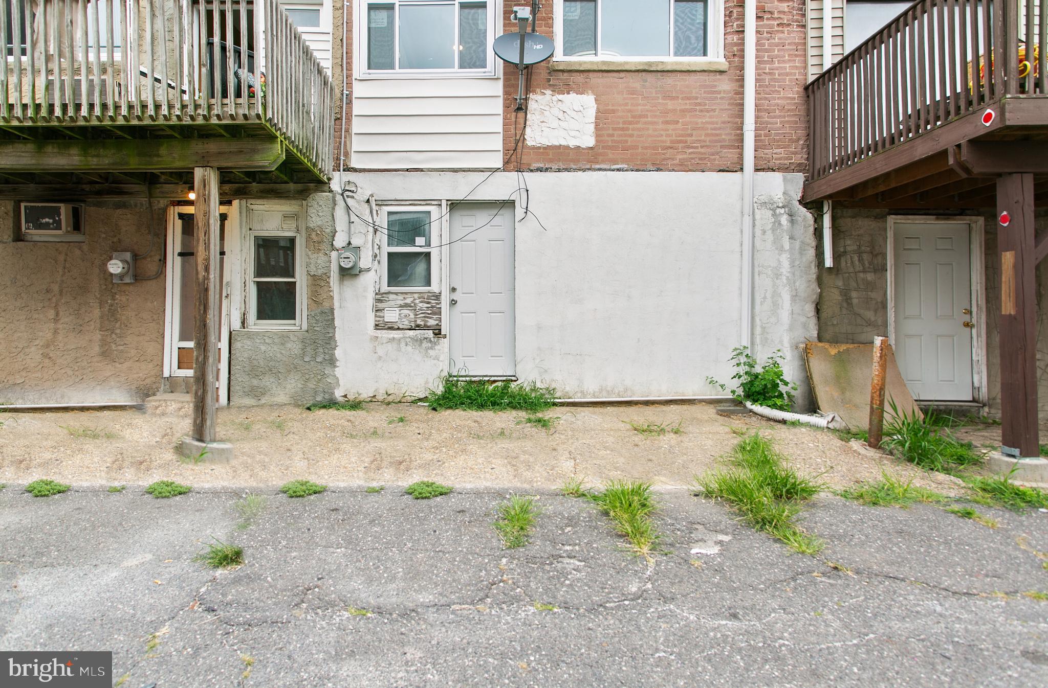 7158 Radbourne Road Upper Darby, PA 19082 - Photo 15 of 15 a view of a brick house with many windows