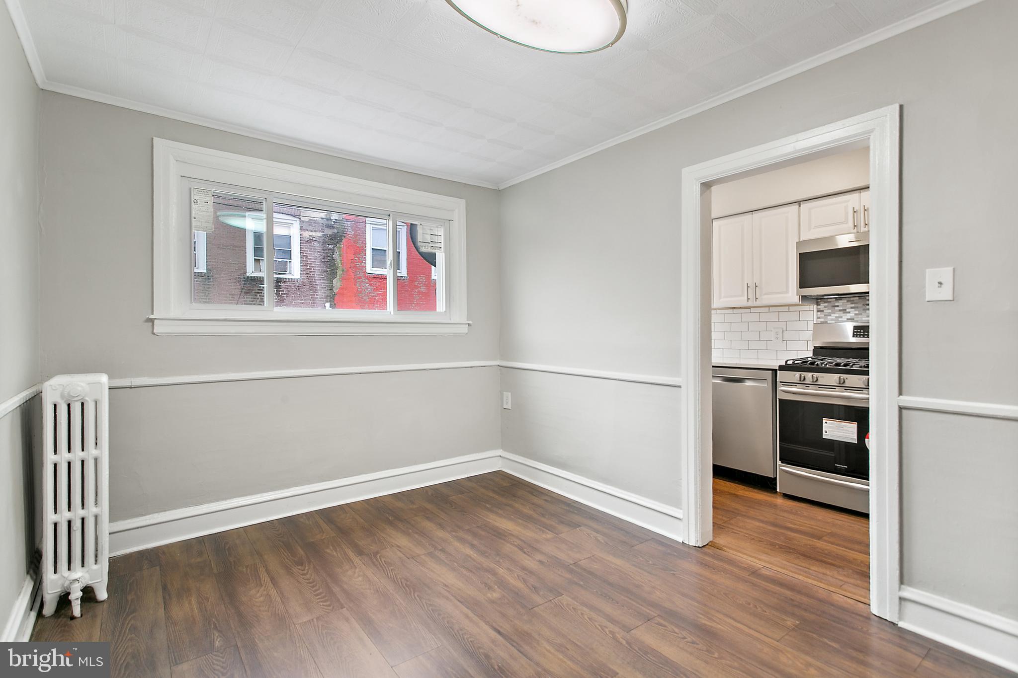 7158 Radbourne Road Upper Darby, PA 19082 - Photo 6 of 15 a view of kitchen and wooden floor