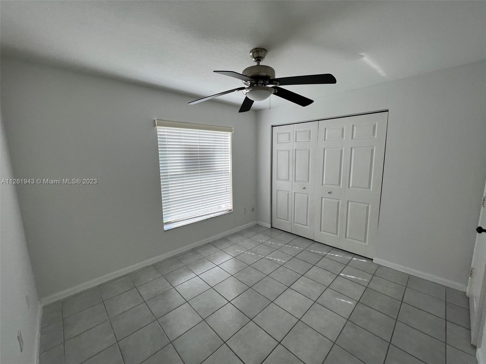705 Southeast 22nd Lane Homestead, FL 33033 - Photo 11 of 43 a view of an empty room and window
