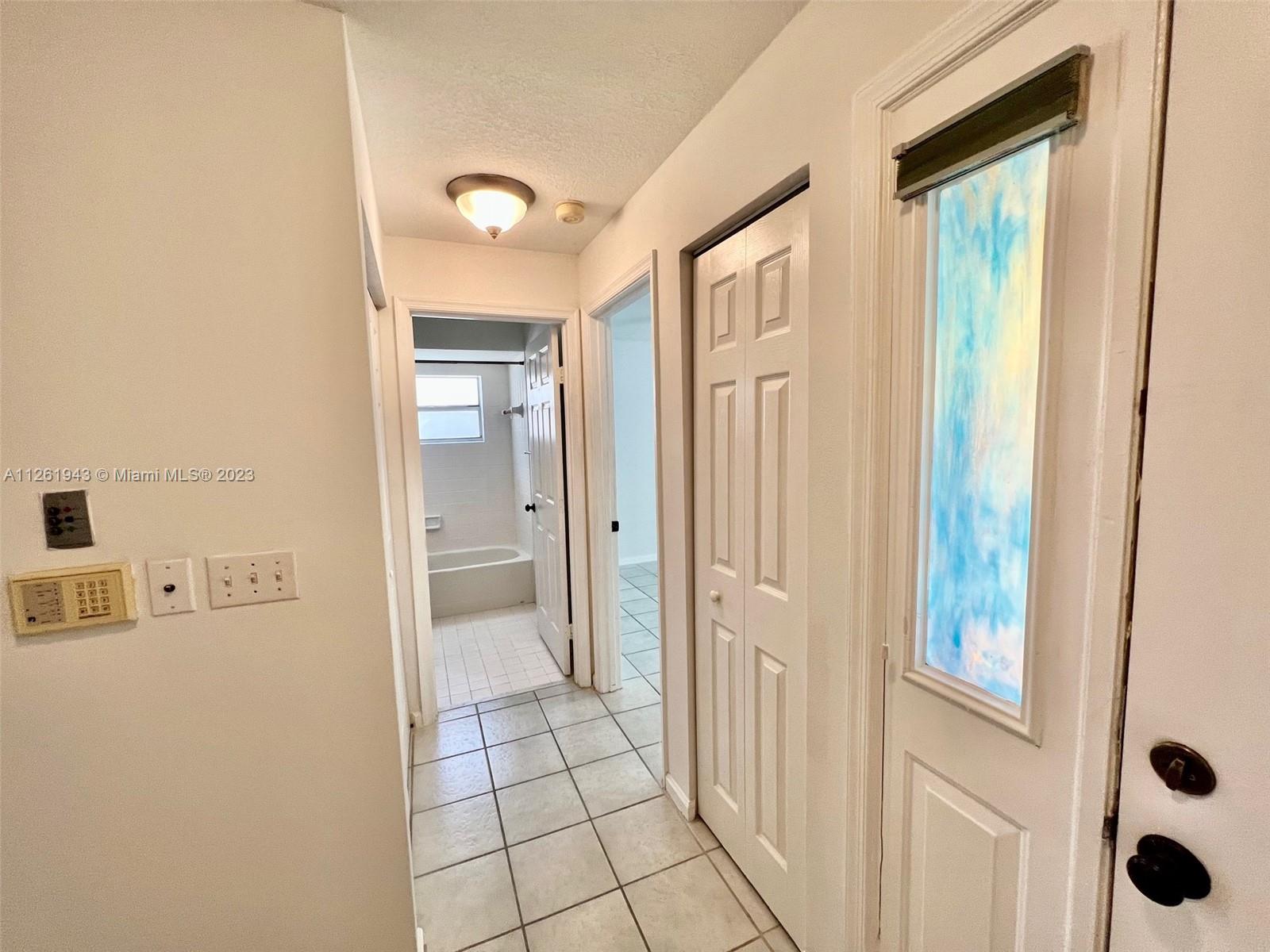 705 Southeast 22nd Lane Homestead, FL 33033 - Photo 17 of 43 a bathroom with a glass door shower
