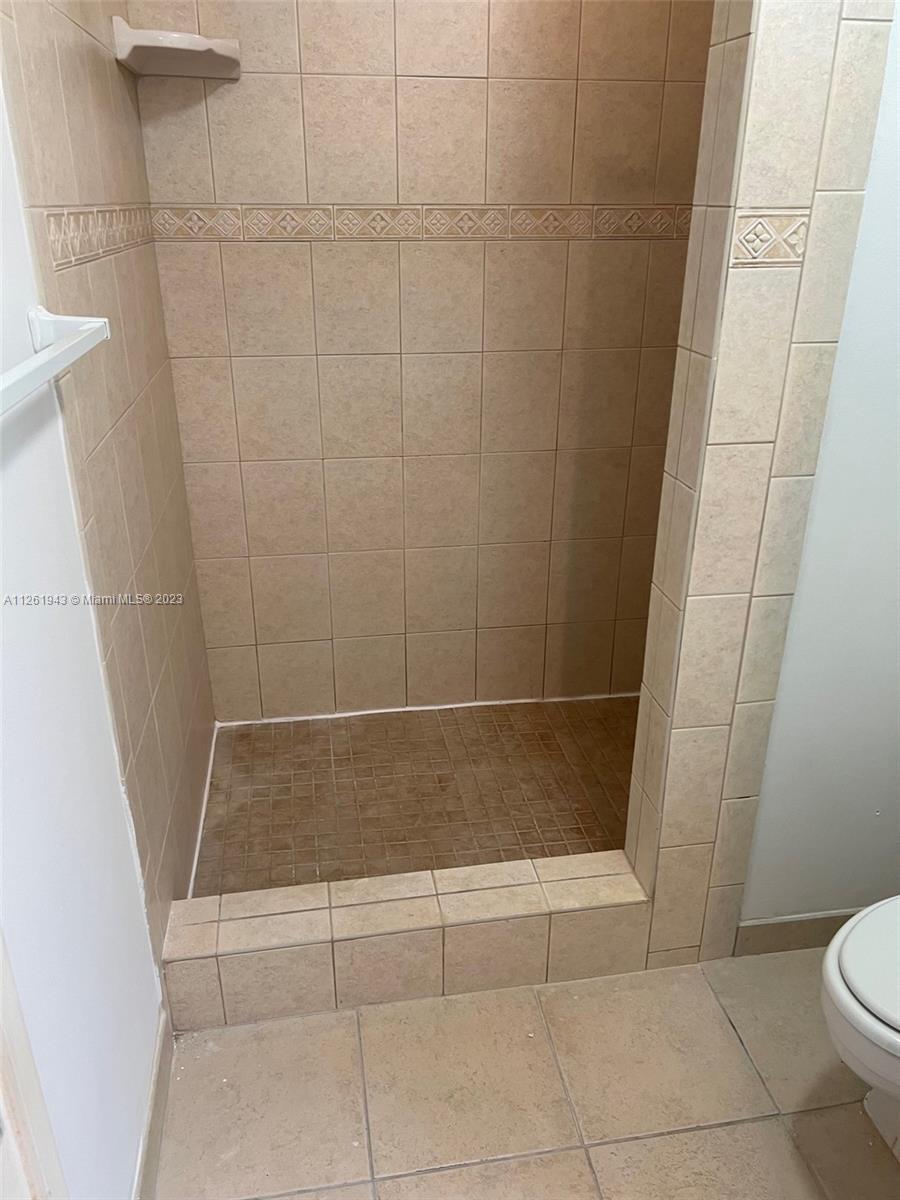705 Southeast 22nd Lane Homestead, FL 33033 - Photo 20 of 43 a bathroom with a shower and toilet