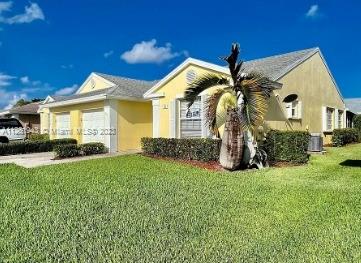 705 Southeast 22nd Lane Homestead, FL 33033 - Photo 2 of 43 a view of a house with a yard