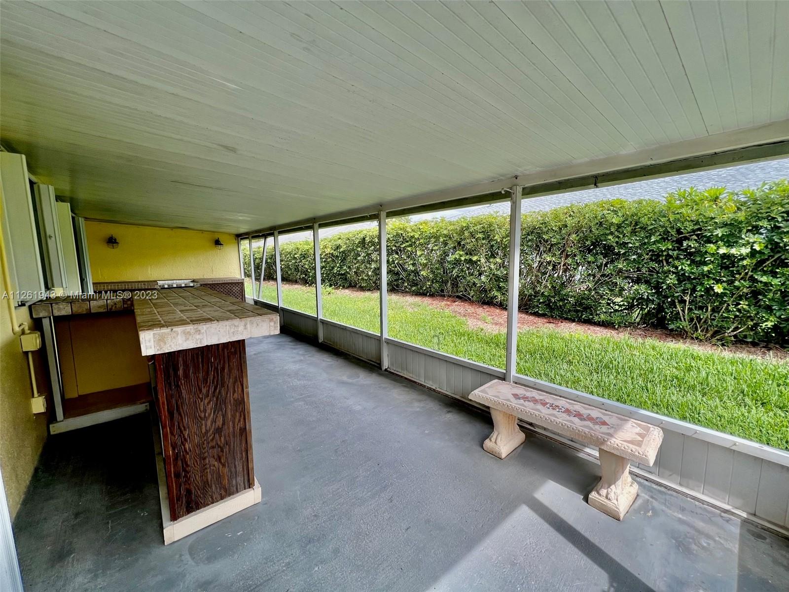 705 Southeast 22nd Lane Homestead, FL 33033 - Photo 28 of 43 a view of a garden with porch