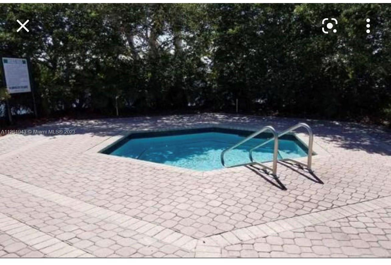 705 Southeast 22nd Lane Homestead, FL 33033 - Photo 33 of 43 a view of swimming pool with a yard