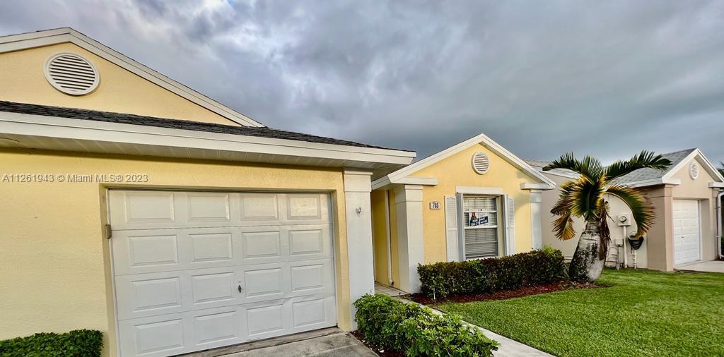 705 Southeast 22nd Lane Homestead, FL 33033 - Photo 42 of 43 a front view of a house with a yard