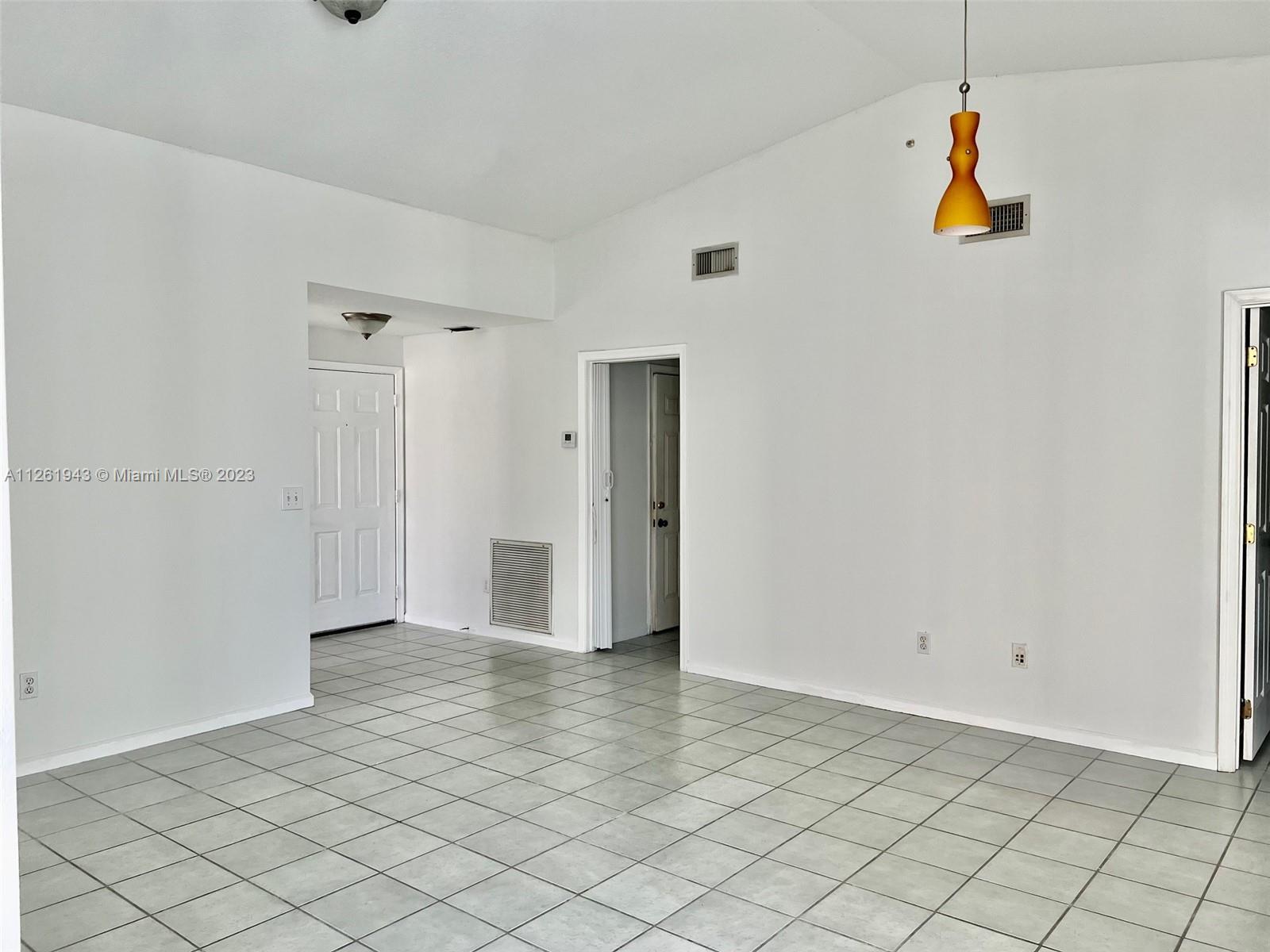 705 Southeast 22nd Lane Homestead, FL 33033 - Photo 6 of 43 a view of empty room