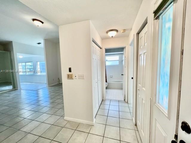 705 Southeast 22nd Lane Homestead, FL 33033 - Photo 8 of 43 a bathroom with a sink and a shower