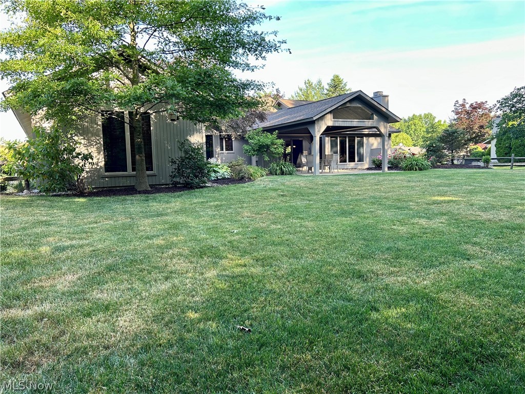 8763 Timber Edge Drive North Ridgeville, OH 44039 - Photo 34 of 40 Back of property featuring a lawn
