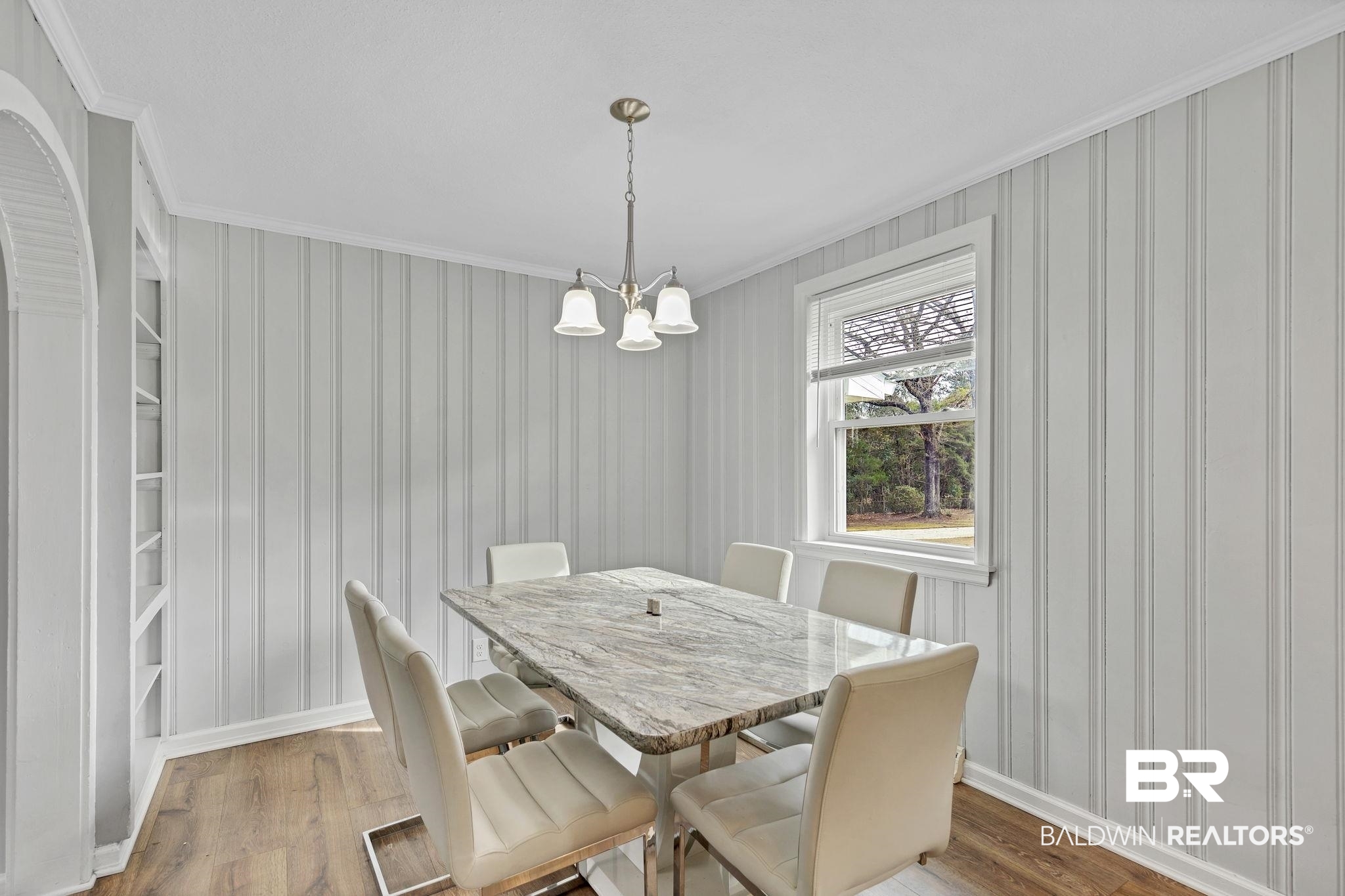 4690 Lott Road Eight Mile, AL 36613 - Photo 16 of 45 Dining area featuring hardwood / wood-style flooring, ornamental molding, a notable chandelier, and built in features
