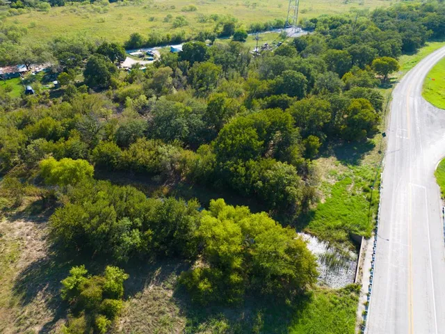 a view of a garden with a building