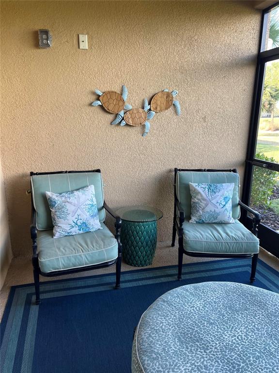 13737 Messina Loop, Unit 101 Bradenton, FL 34211 - Photo 13 of 25 a living room with furniture and a rug