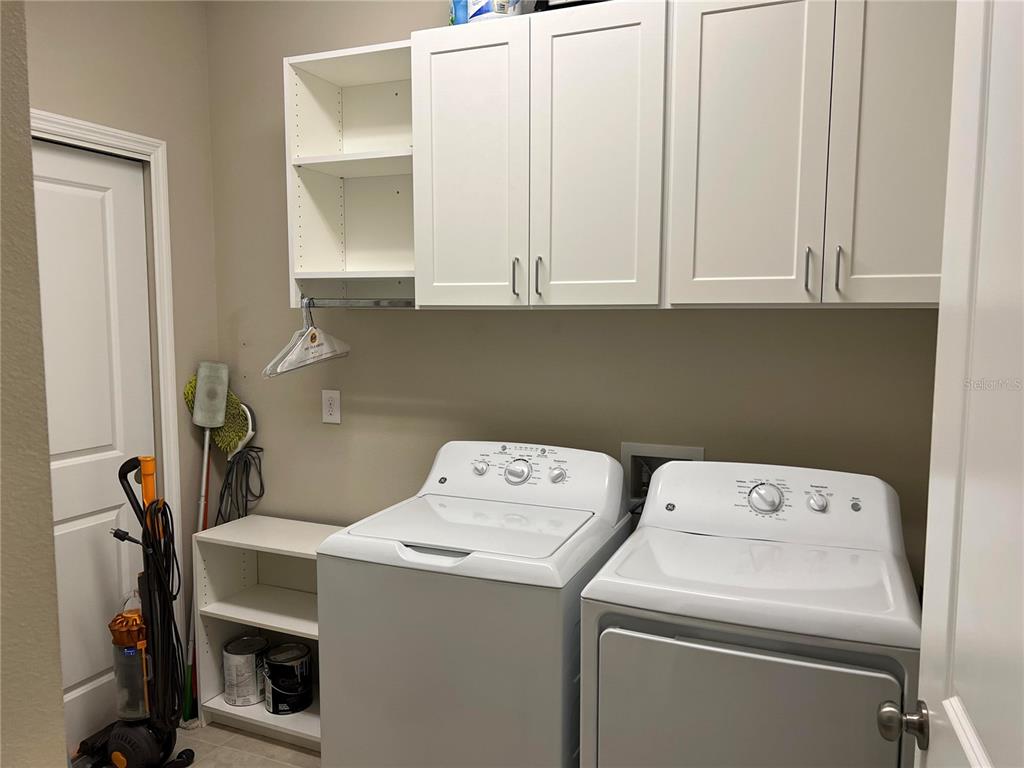 13737 Messina Loop, Unit 101 Bradenton, FL 34211 - Photo 15 of 25 a utility room with dryer and washer