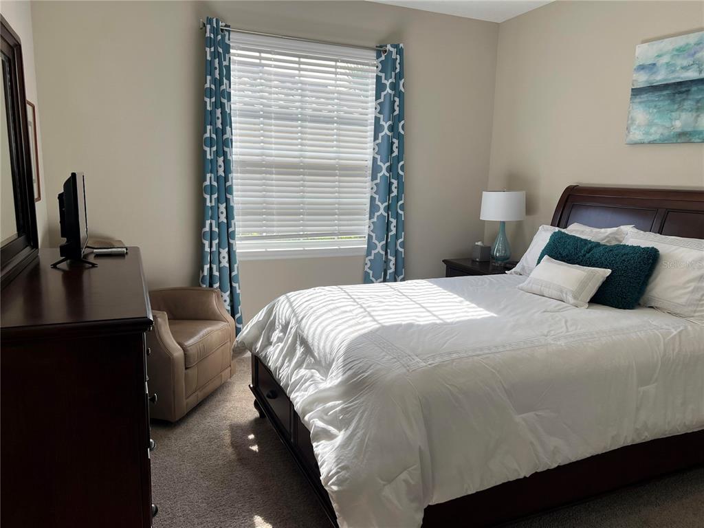 13737 Messina Loop, Unit 101 Bradenton, FL 34211 - Photo 20 of 25 a bedroom with a bed and window