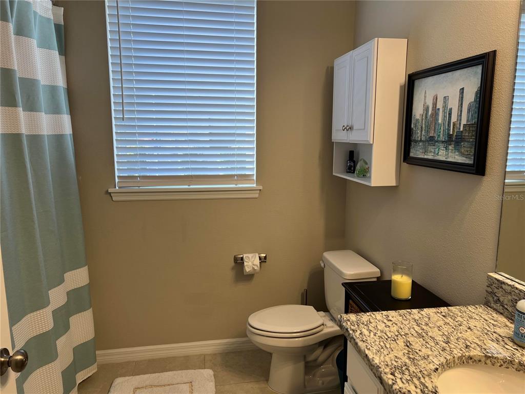 13737 Messina Loop, Unit 101 Bradenton, FL 34211 - Photo 21 of 25 a bathroom with a toilet and a sink