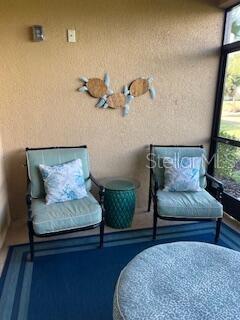 13737 Messina Loop, Unit 101 Bradenton, FL 34211 - Photo 24 of 25 a living room with furniture and a window