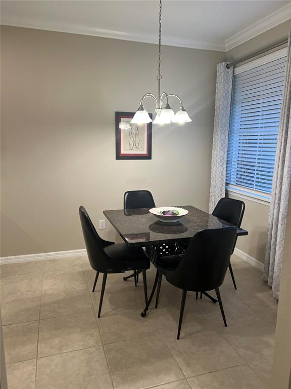 13737 Messina Loop, Unit 101 Bradenton, FL 34211 - Photo 6 of 25 a view of a dining room with a table and chairs