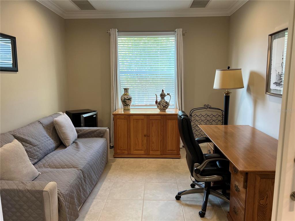 13737 Messina Loop, Unit 101 Bradenton, FL 34211 - Photo 8 of 25 a living room with furniture and a window