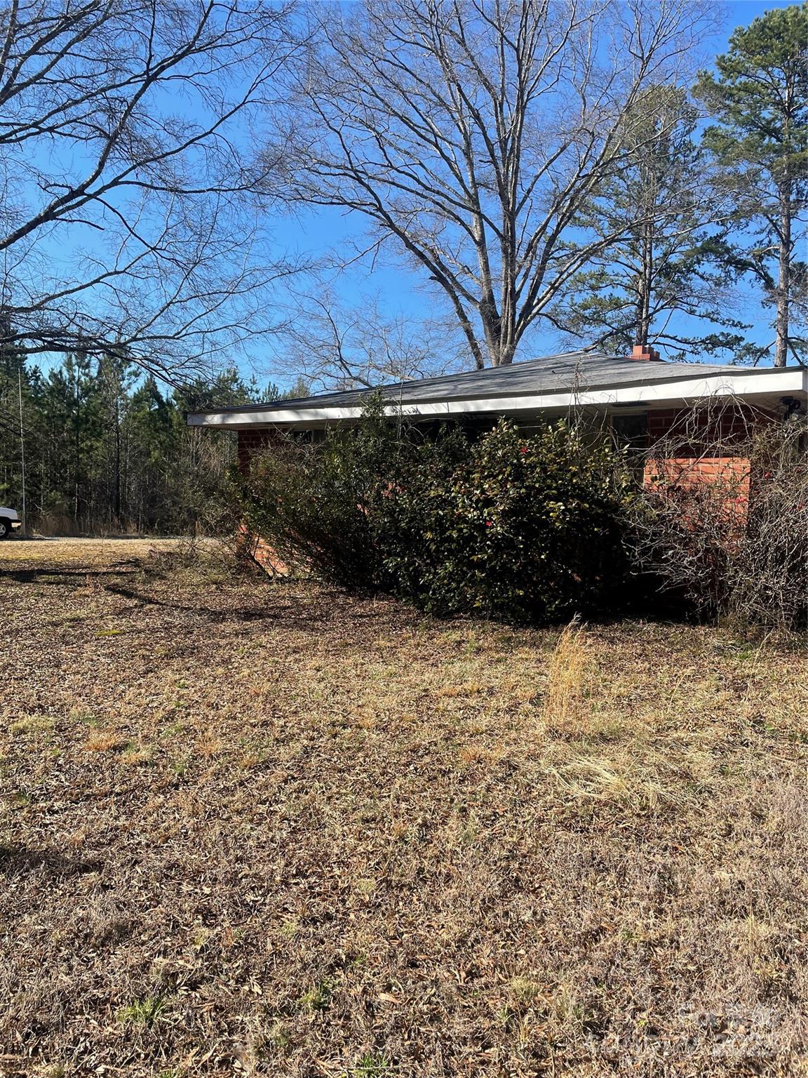 37254 Barnhardt Road Albemarle, NC 28001 - Photo 6 of 10 a view of backyard and wooden fence