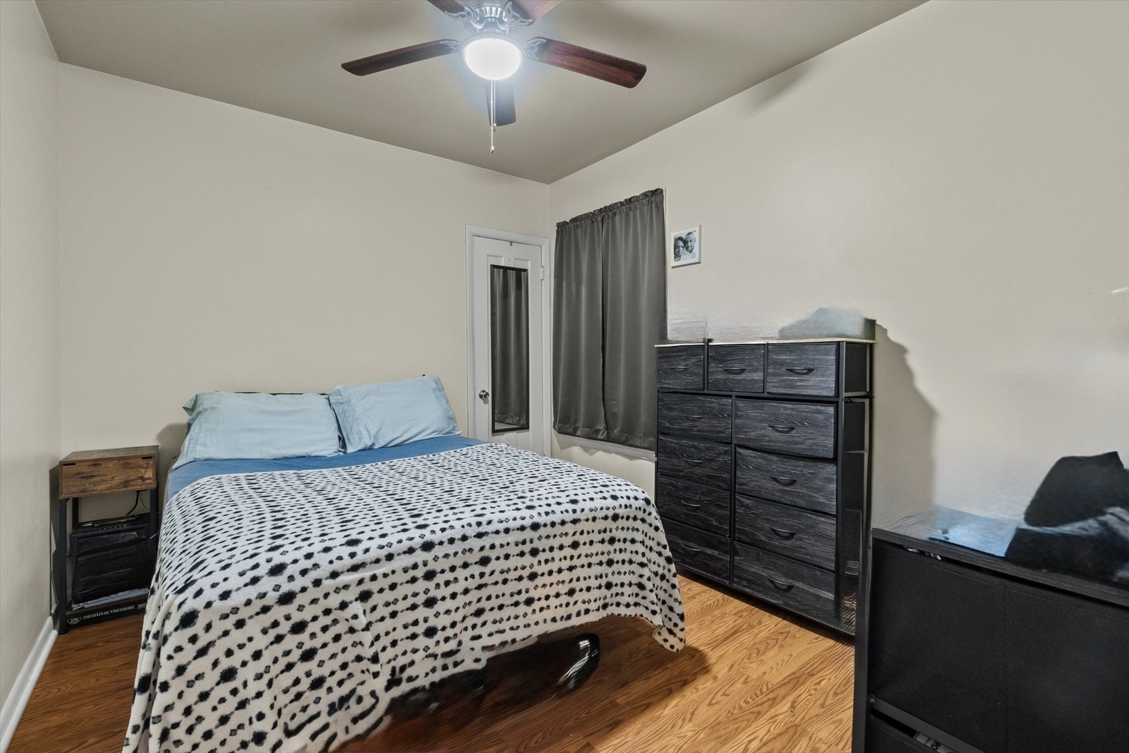 4820 West Haddon Avenue Chicago, IL 60651 - Photo 11 of 27 a bedroom with a bed and dresser