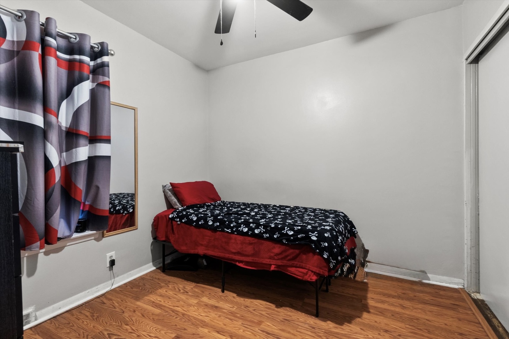 4820 West Haddon Avenue Chicago, IL 60651 - Photo 12 of 27 a bedroom with a bed and a walk in closet