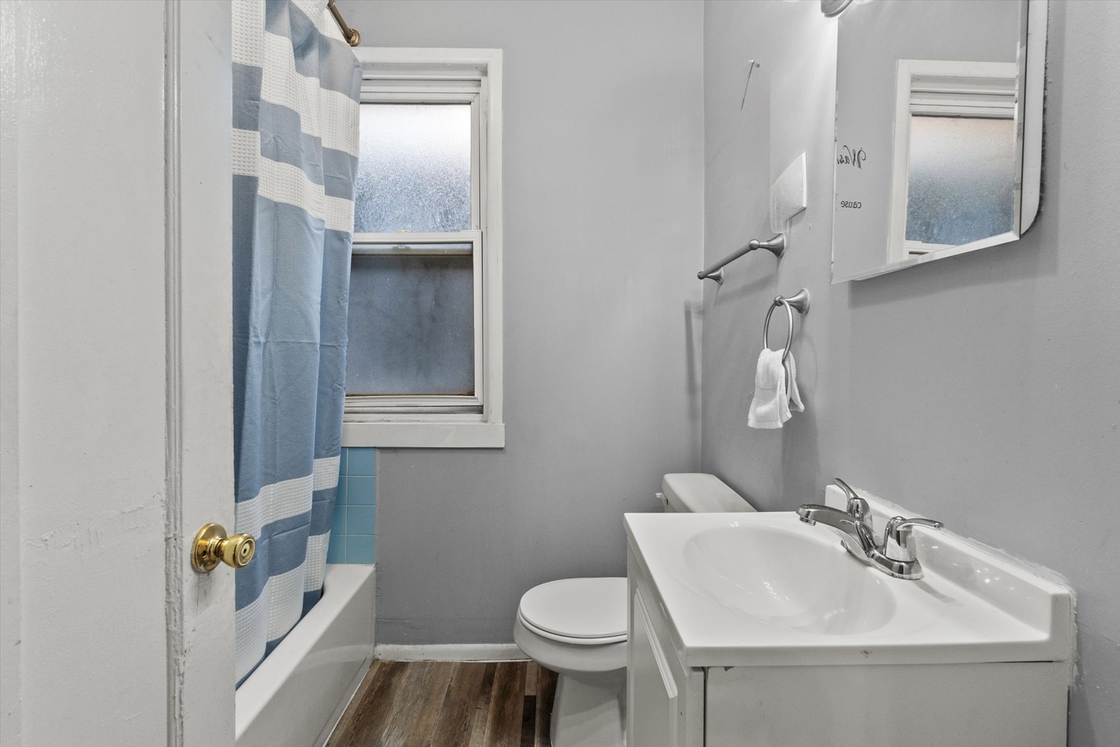 4820 West Haddon Avenue Chicago, IL 60651 - Photo 13 of 27 a bathroom with a sink toilet and mirror
