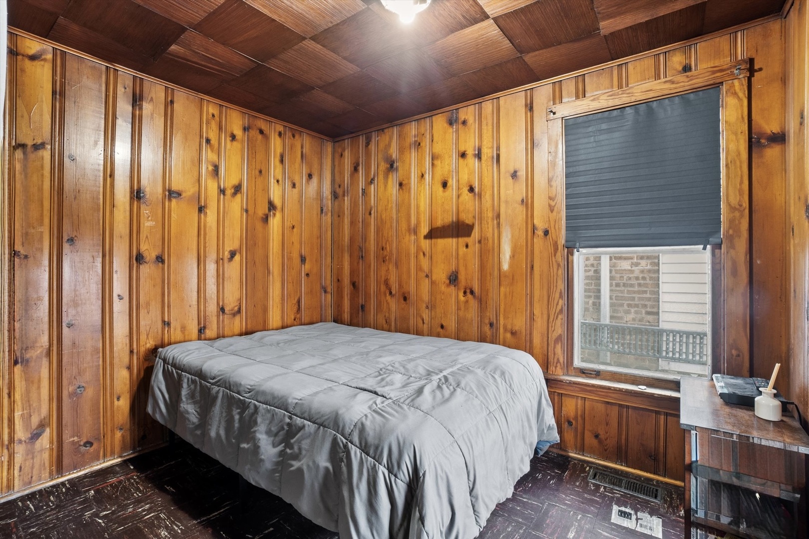 4820 West Haddon Avenue Chicago, IL 60651 - Photo 14 of 27 a bedroom with a bed and a window
