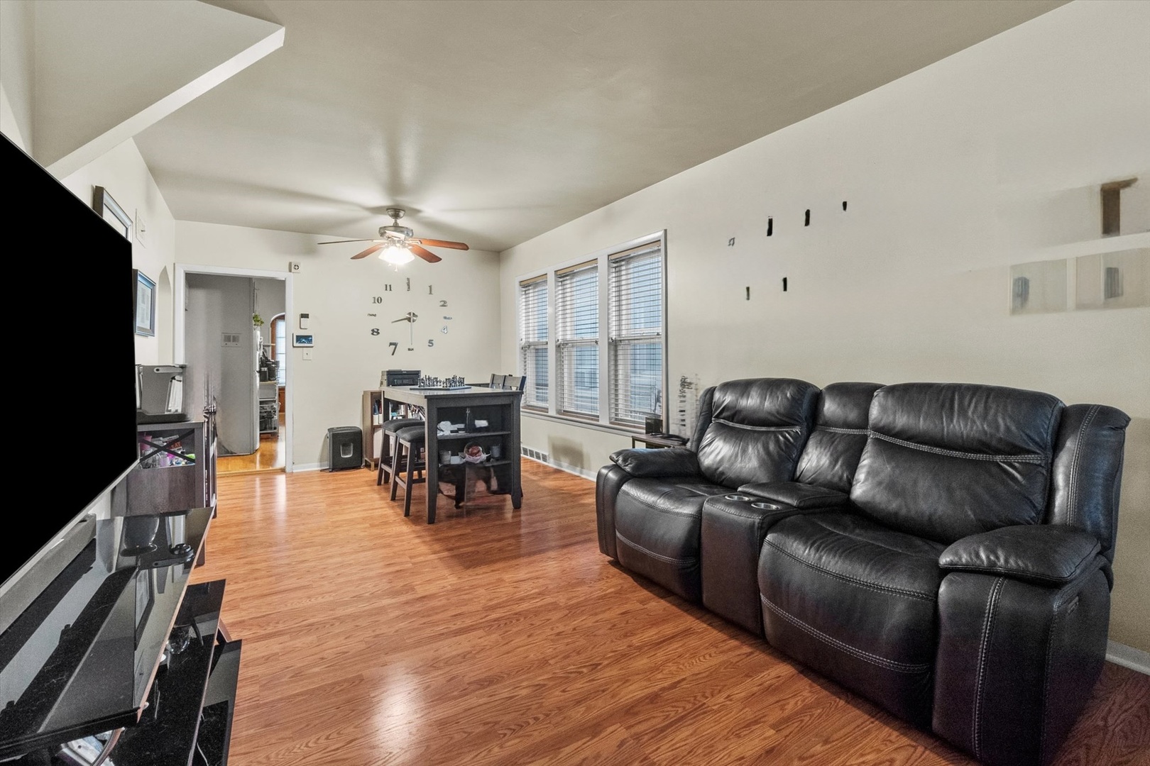 4820 West Haddon Avenue Chicago, IL 60651 - Photo 2 of 27 a living room with furniture and a flat screen tv
