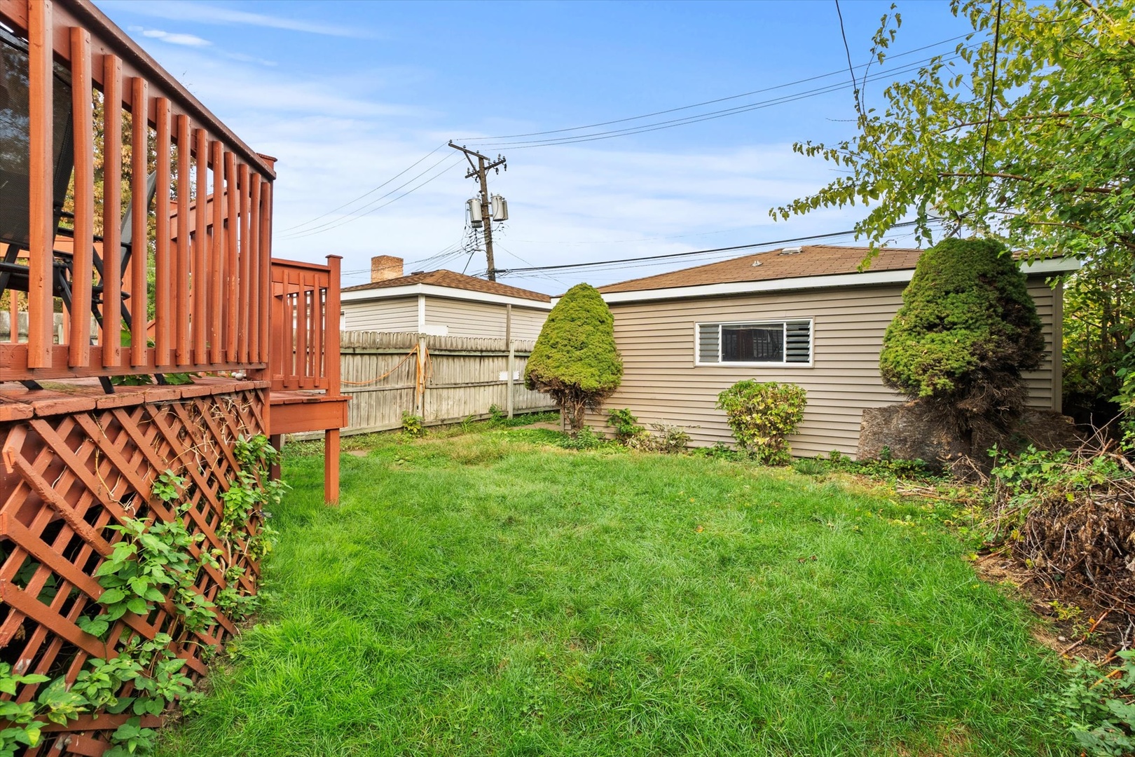 4820 West Haddon Avenue Chicago, IL 60651 - Photo 22 of 27 a front view of a house with garden