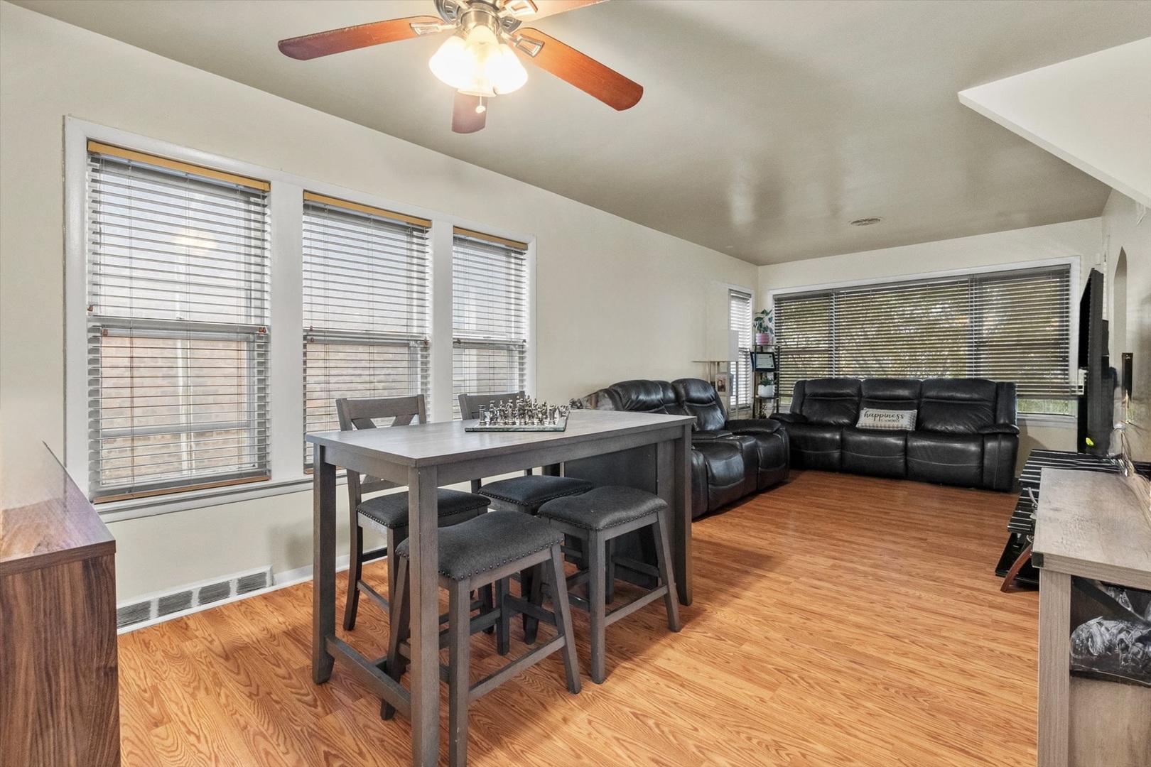 4820 West Haddon Avenue Chicago, IL 60651 - Photo 5 of 27 a view of a dining room with furniture window and wooden floor