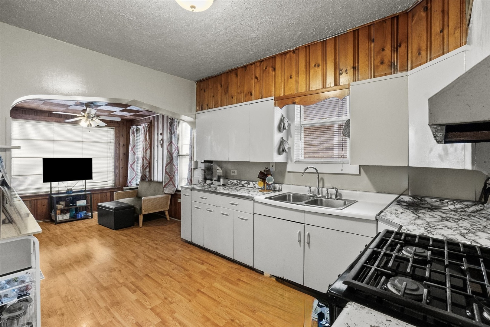 4820 West Haddon Avenue Chicago, IL 60651 - Photo 6 of 27 a kitchen with a stove a sink and a refrigerator