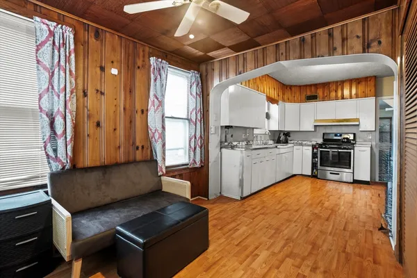 a kitchen with granite countertop a stove and cabinets